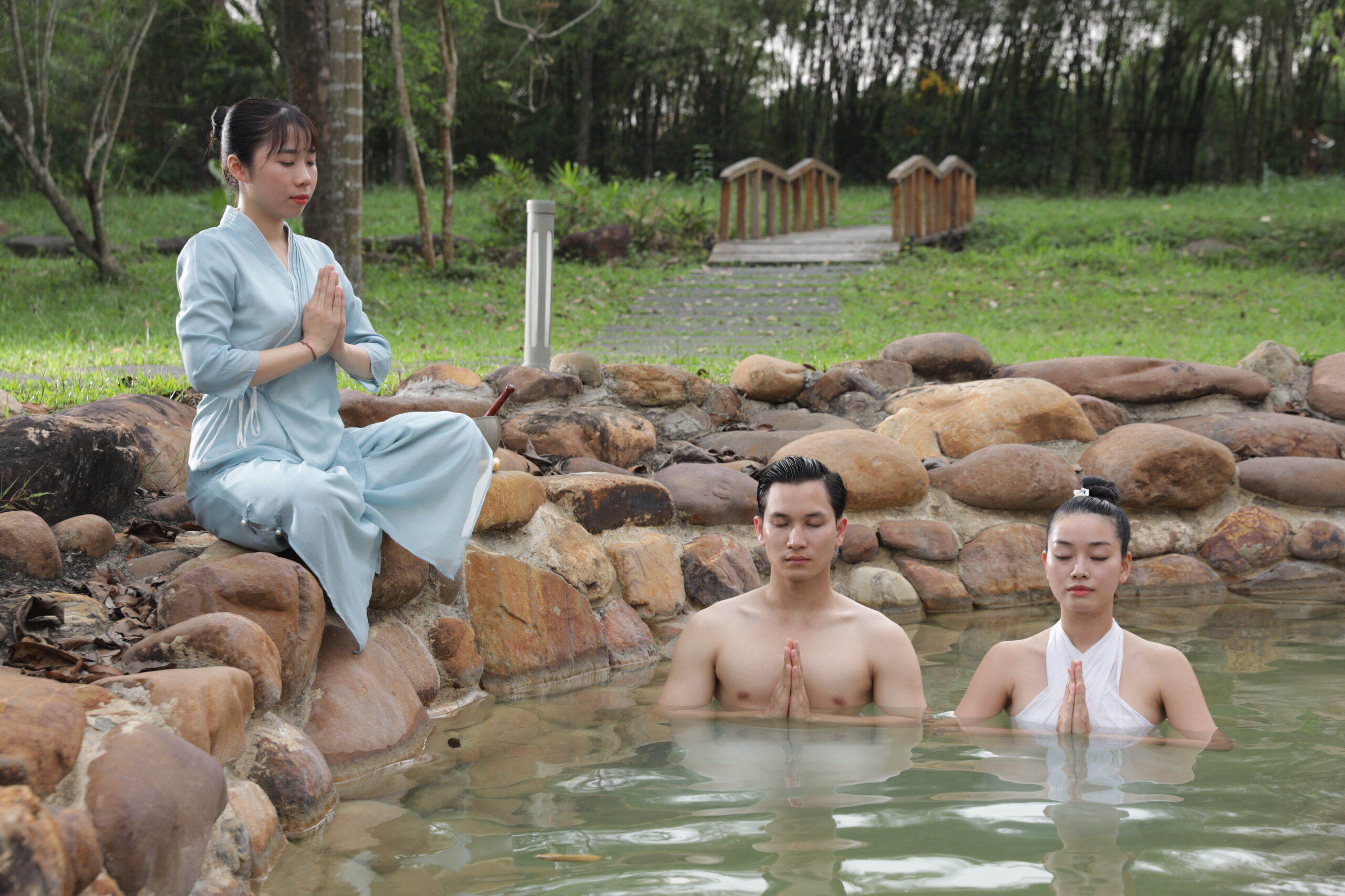 Three people in the hotspring